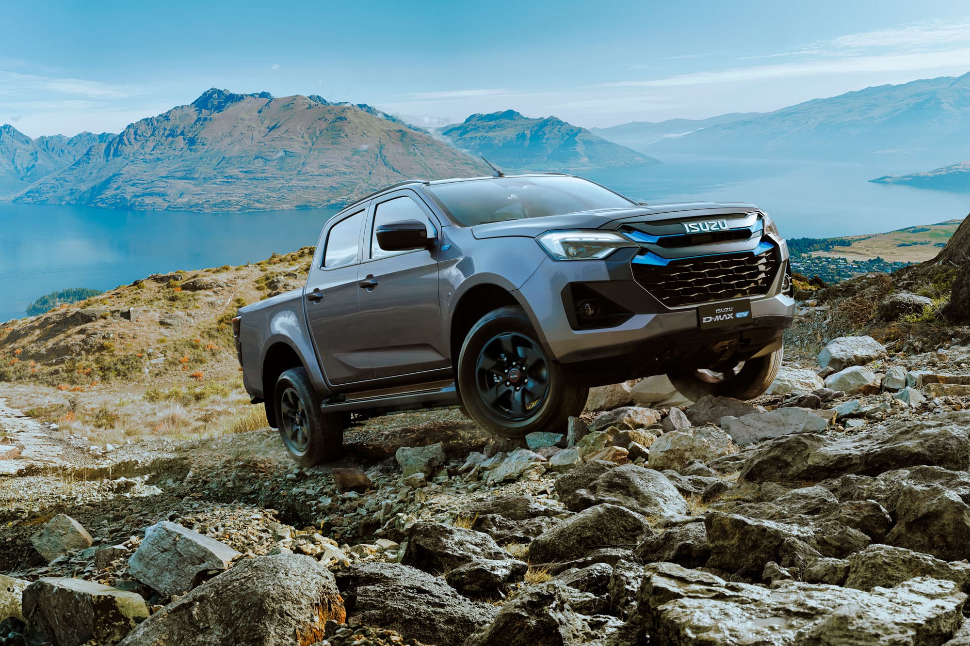 Grey Isuzu D-MAX EV Double Cab driving off road